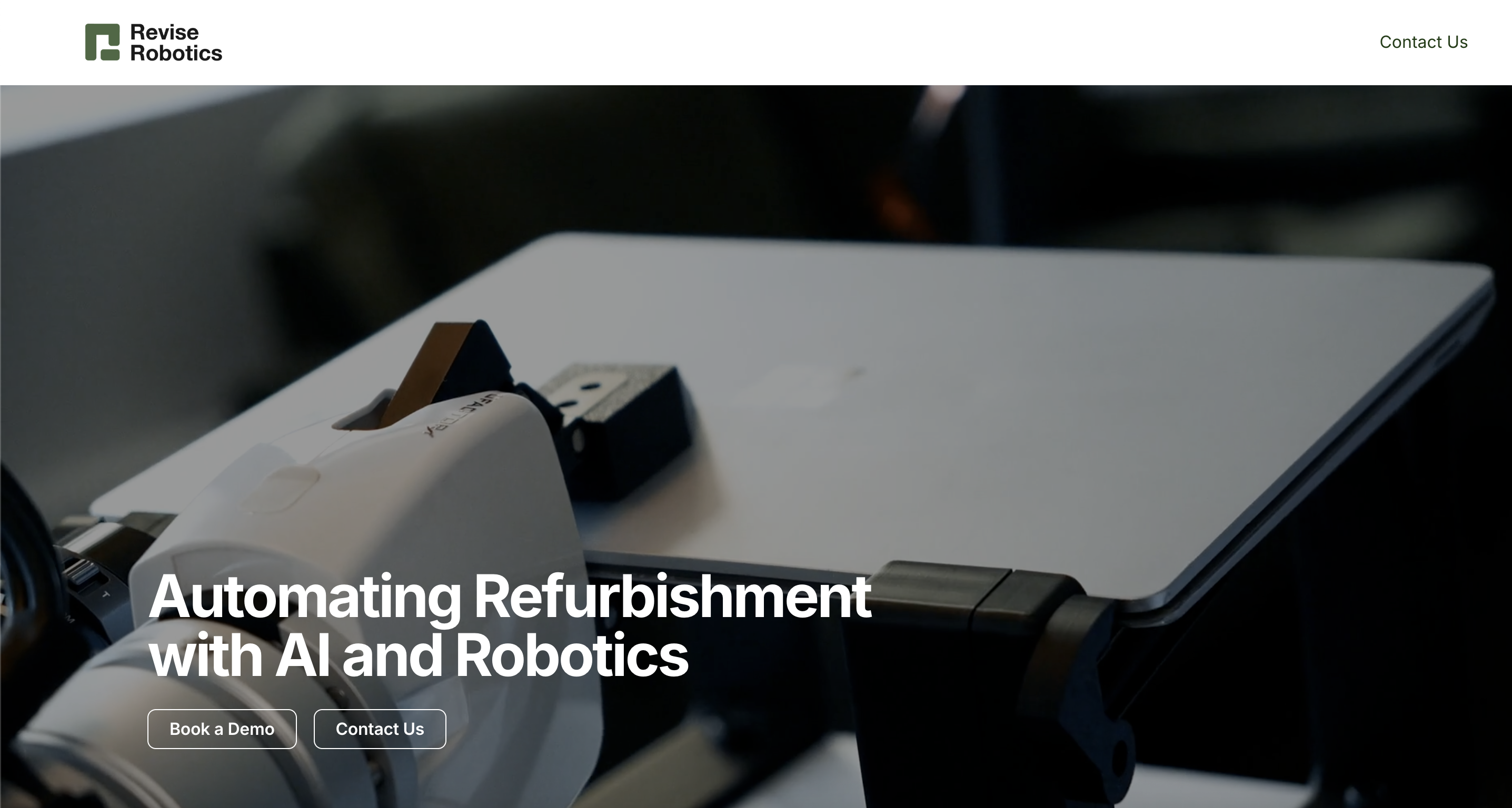 Revise Robotics robotic arm handling a laptop for refurbishment
